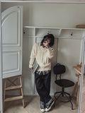 Rich cable V-neck knitwear