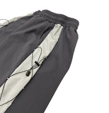 Color matching cross string nylon pants