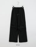 [unisex] Lyov banding cut-out string parachute nylon pants