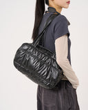Padded glossy leather shoulder bag