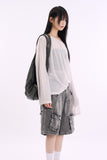 Layering see-through linen cool over knit