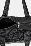 Padded glossy leather shoulder bag