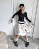 SNAP WRAP SOLID PLEATS SKIRT