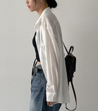 Holding see-through loose fit shirt