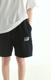 [23.65] LOGO BANDING HALF PANTS