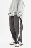 Oblique side zip-up wide banding pants