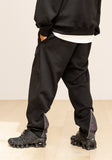 GRATING EMBLEM BACK SLIT ZIP PANTS